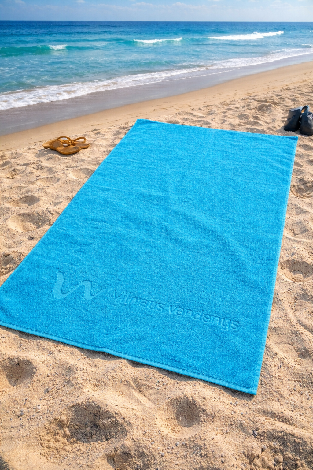 Rankšluostis su logotipo įspaudu